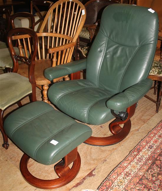 Blue leather reclining armchair and stool